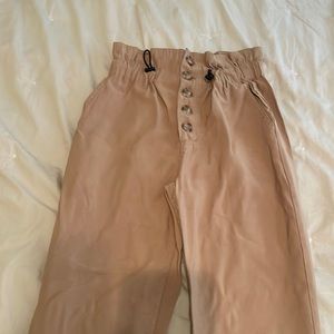 Camel colored high waisted pants with tapered ankles